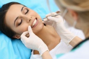 Young female patient visiting dentist office.